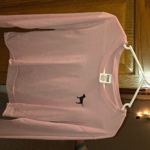 pink cropped long sleeve shirt